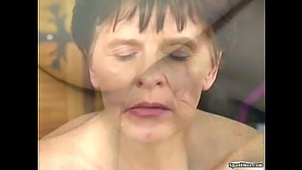 Older Woman Enjoys A Facial From A Younger Man